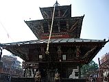 Kathmandu Patan 02-3 Rato Red Machhendranath Temple North Doorway Guarded By Two Snow Lions With Animals On Top Of Pillars 